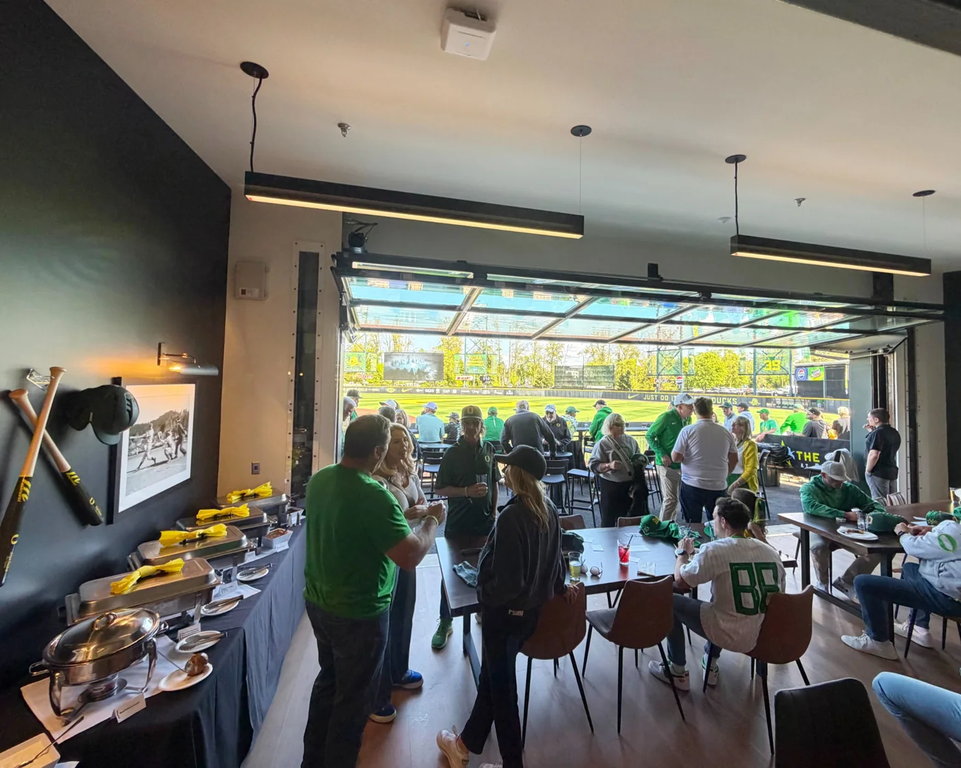 Premium indoor hospitality suite overlooking a baseball field in Eugene